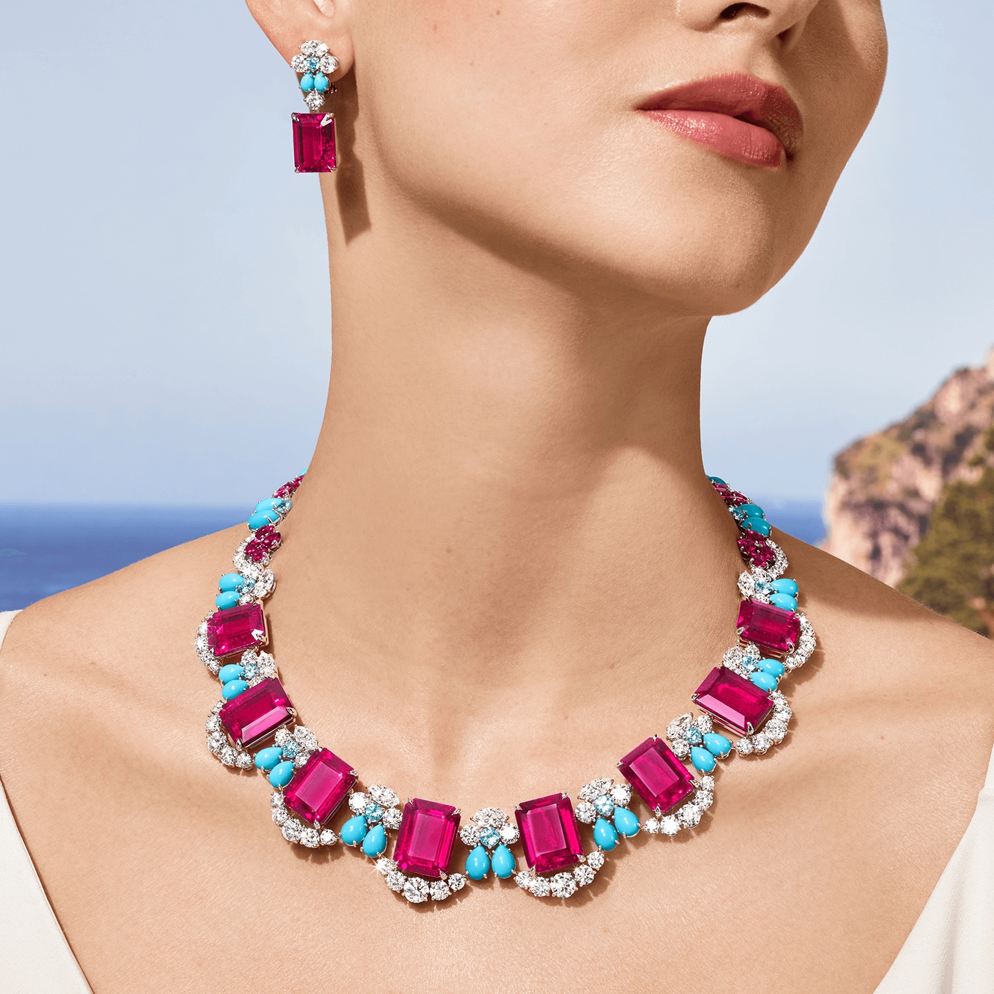 A female wearing the Amalfi Necklace with ocean on the background
